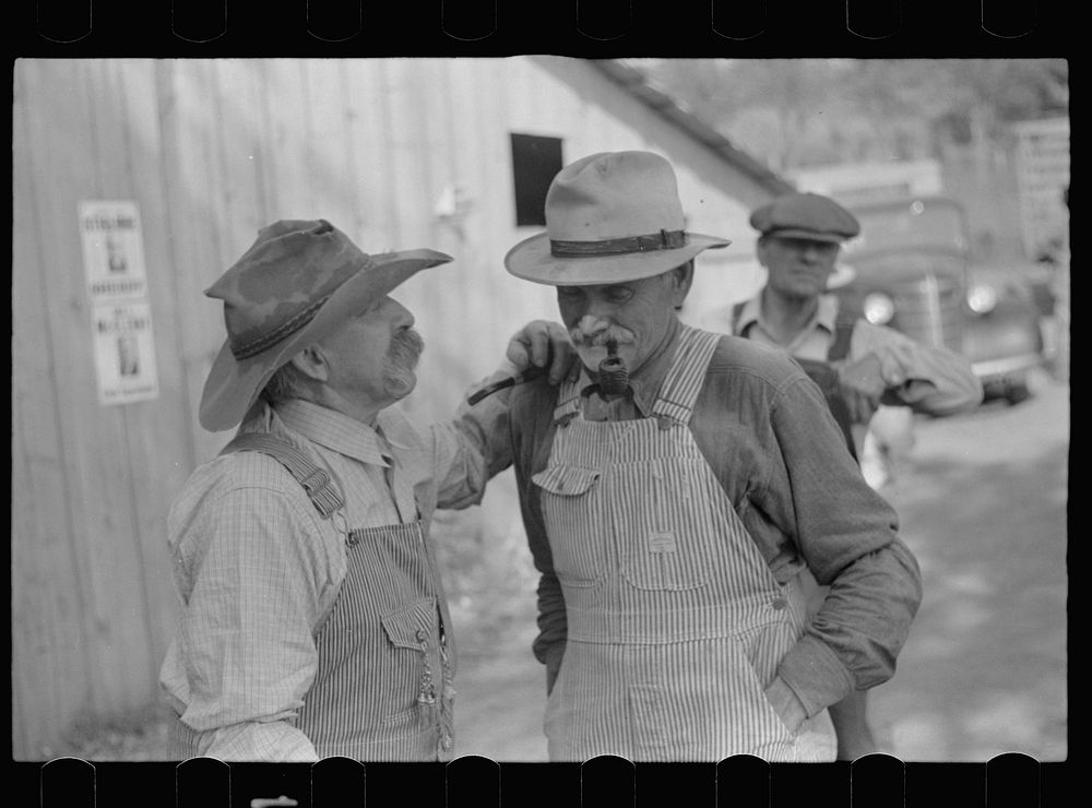 Farmers waiting for the auction to begin. Oskaloosa, Kansas. Sourced from the Library of Congress.
