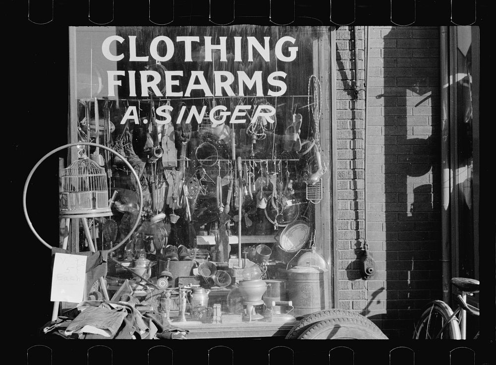 Secondhand goods. Note surgical instruments in window, Omaha, Nebraska. Sourced from the Library of Congress.
