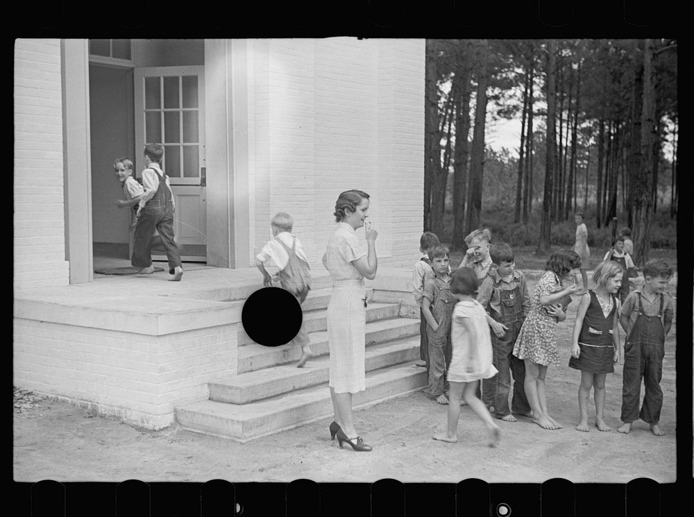 [Untitled photo, possibly related to: Schoolteacher and children, Irwinville School, Georgia]. Sourced from the Library of…