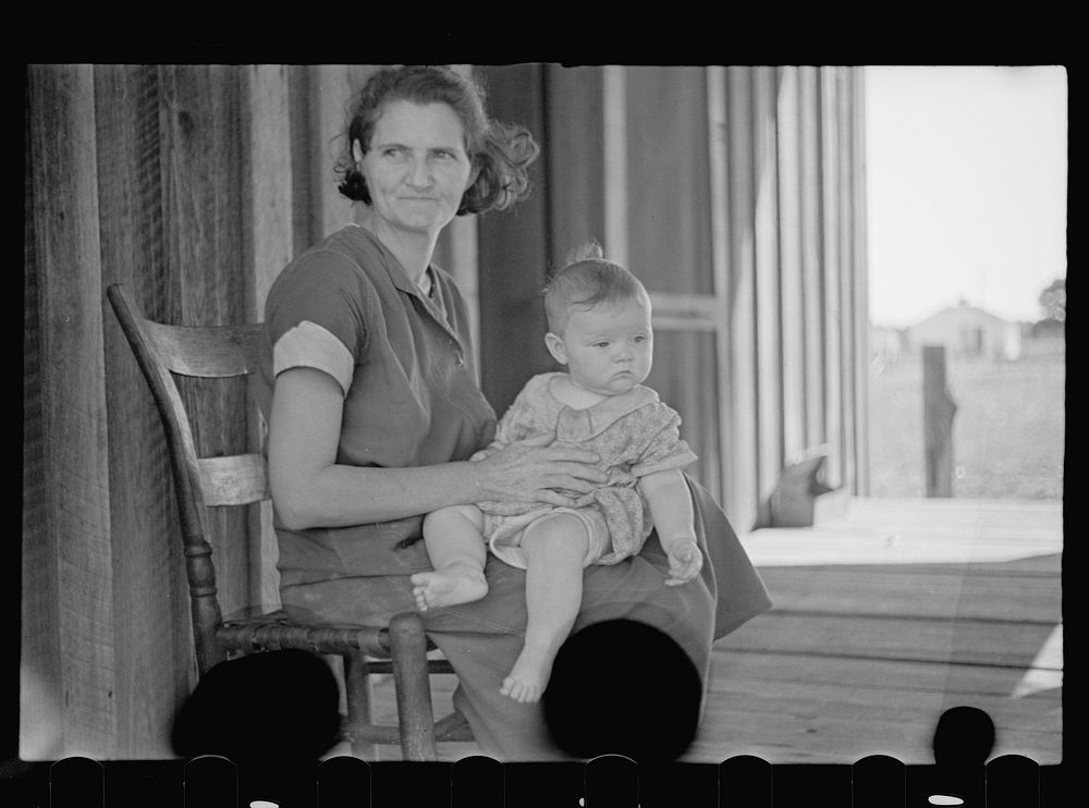 Wife and baby of tenant farmer, Irwin County, Georgia. Sourced from the Library of Congress.