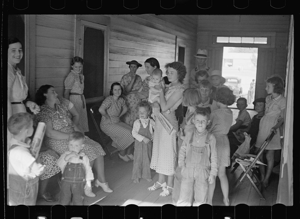 Women and children waiting to see the doctor, who visits the project once a week. Irwinville Farms, Georgia. Sourced from…