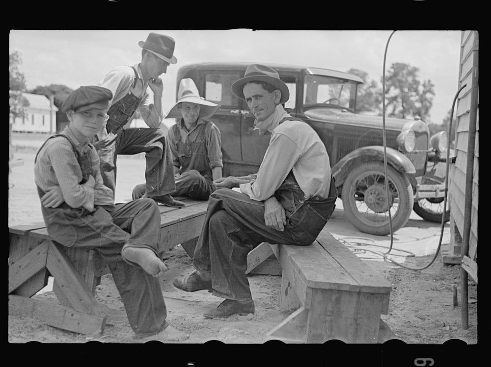 [Untitled photo, possibly related to: Rolling a cigarette. Irwinville Farms, Georgia]. Sourced from the Library of Congress.