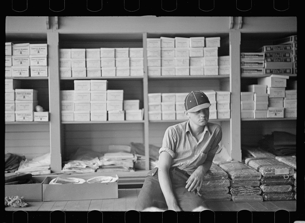 Farm boy in the cooperative store at Irwinville Farms, Georgia. Sourced from the Library of Congress.