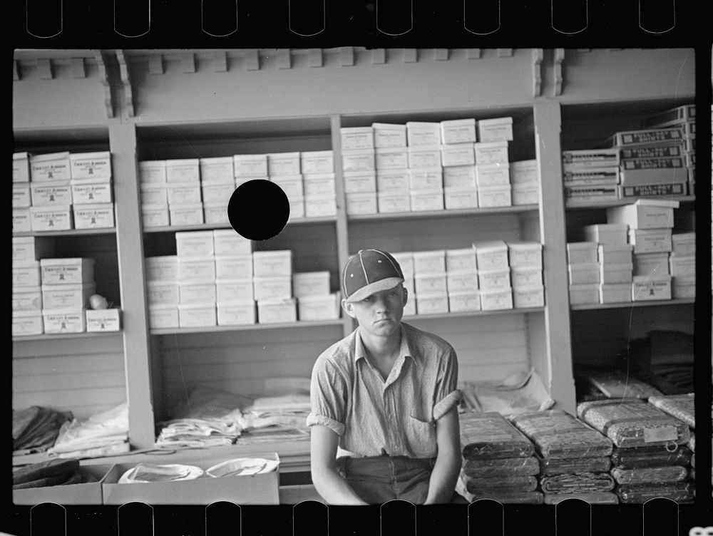 [Untitled photo, possibly related to: Farm boy in the cooperative store at Irwinville Farms, Georgia]. Sourced from the…