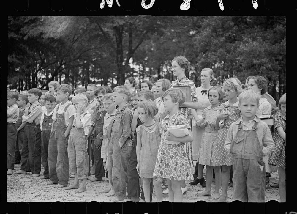 Children at flag raising. Irwinville School, Georgia. Sourced from the Library of Congress.