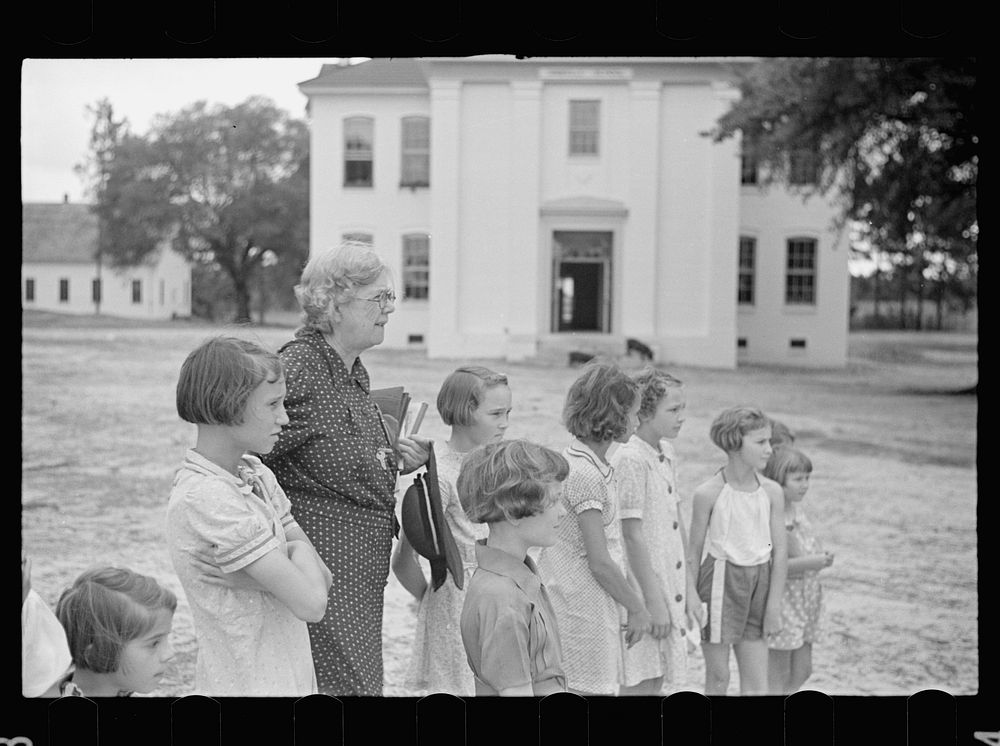 School principal and children. Irwinville School, Georgia. Sourced from the Library of Congress.