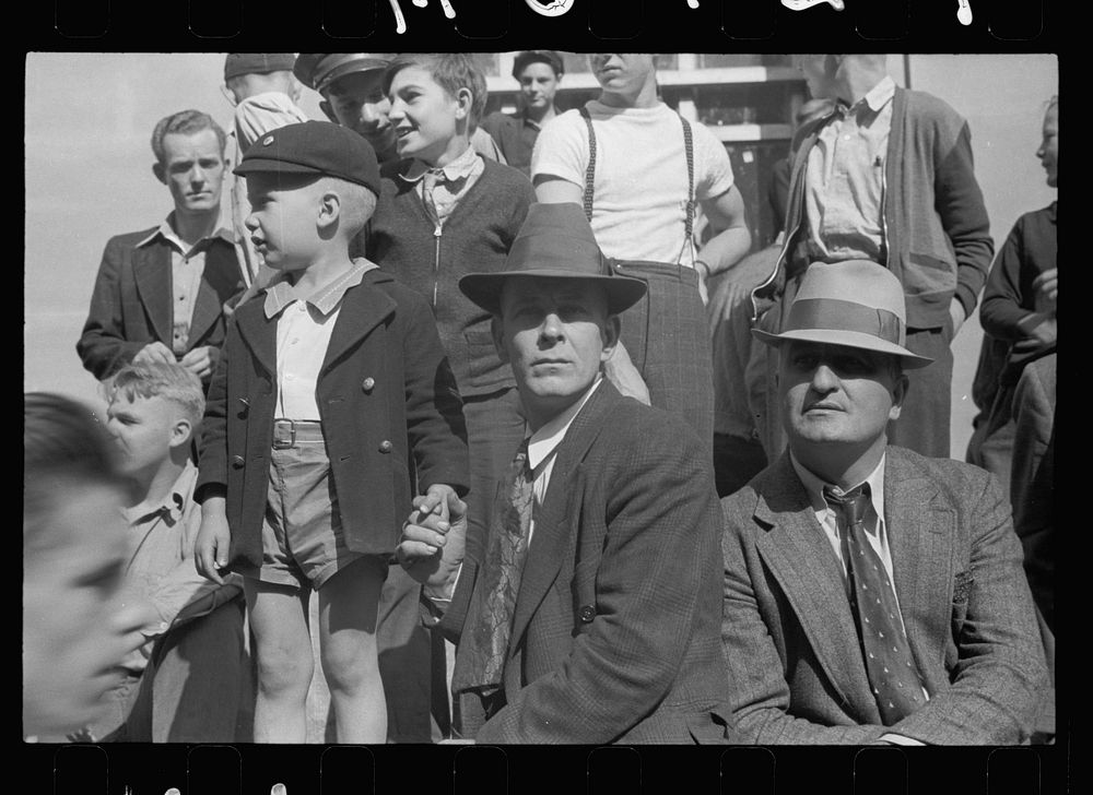 [Untitled photo, possibly related to: Waiting for the parade to pass, Cincinnati, Ohio]. Sourced from the Library of…