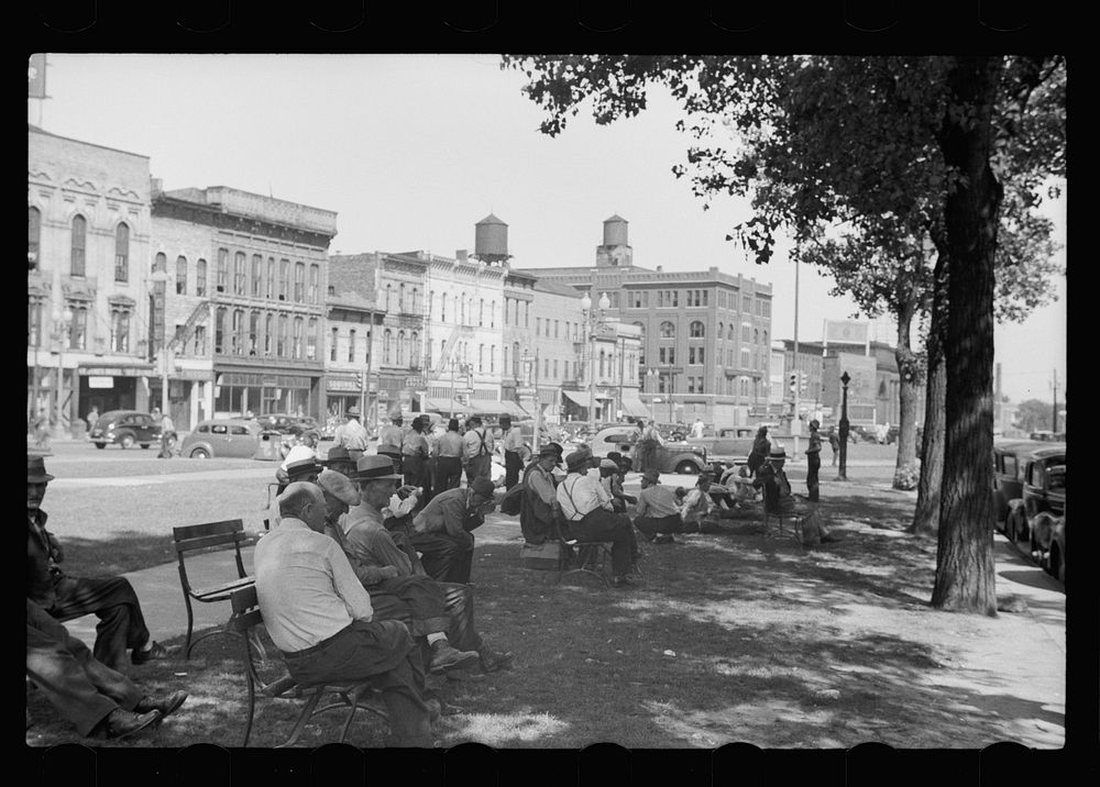 [Untitled photo, possibly related to: Men sitting in the park, Gateway District, Minneapolis, Minnesota]. Sourced from the…
