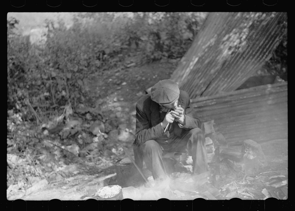 [Untitled photo, possibly related to: Man in hobo jungle killing turtle to make soup, Minneapolis, Minnesota]. Sourced from…