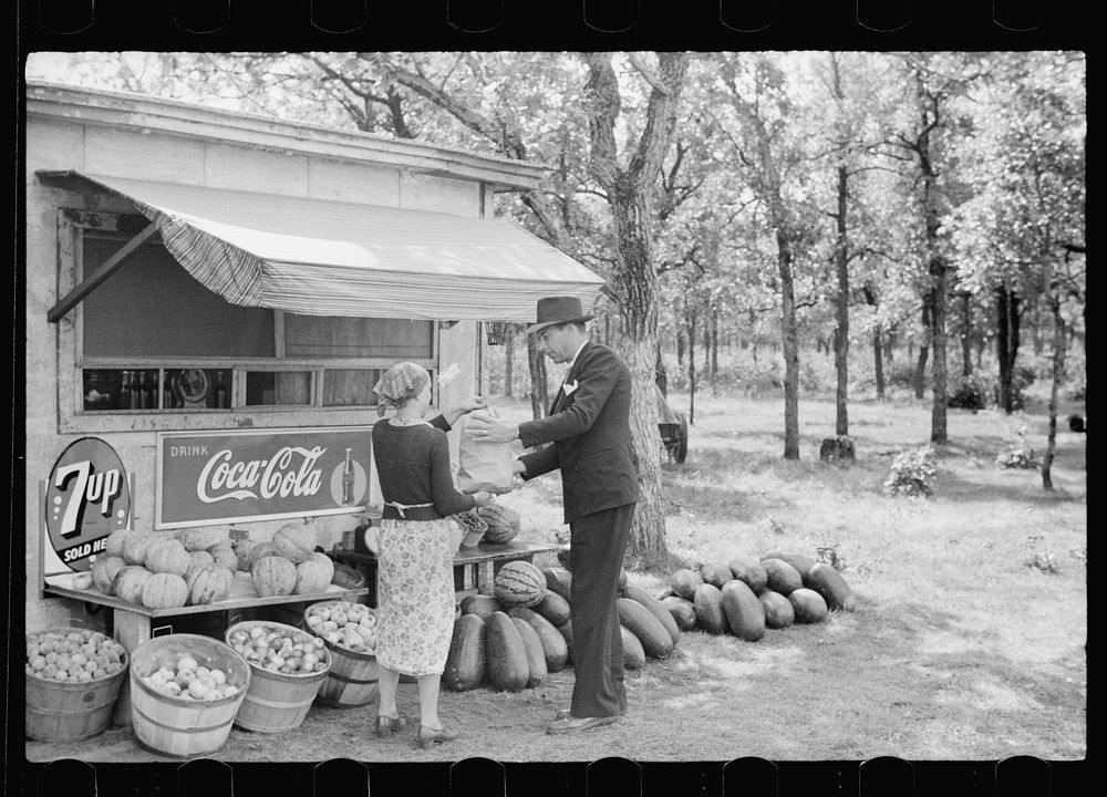 Making a purchase at farmer's roadside stand, Eau Clair County, Wisconsin. Sourced from the Library of Congress.