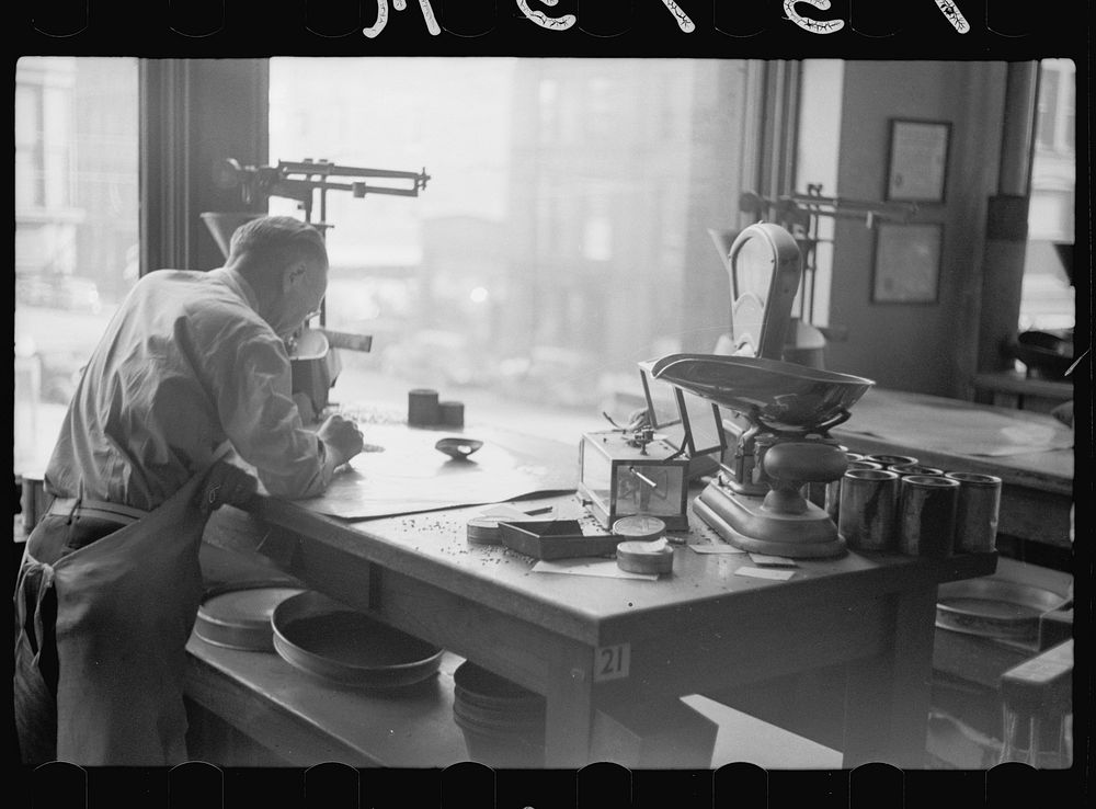 [Untitled photo, possibly related to: Testing for impurities in wheat at Minnesota grain inspection dept., Minneapolis…