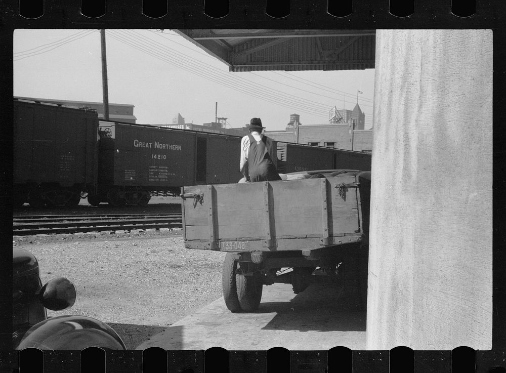 [Untitled photo, possibly related to: Unloading sacks of wheat at elevator, Minneapolis, Minnesota]. Sourced from the…