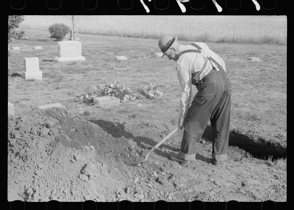 Grave digger at work, Woodbine, Iowa. Sourced from the Library of Congress.