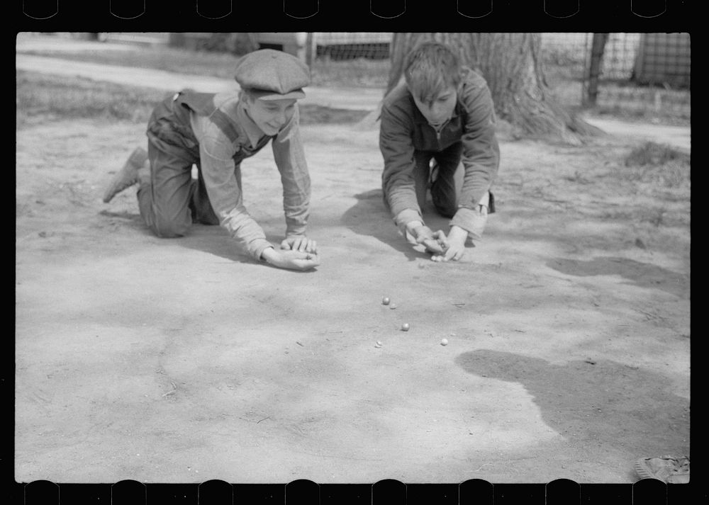[Untitled photo, possibly related to: Boys playing marbles, Woodbine, Iowa]. Sourced from the Library of Congress.