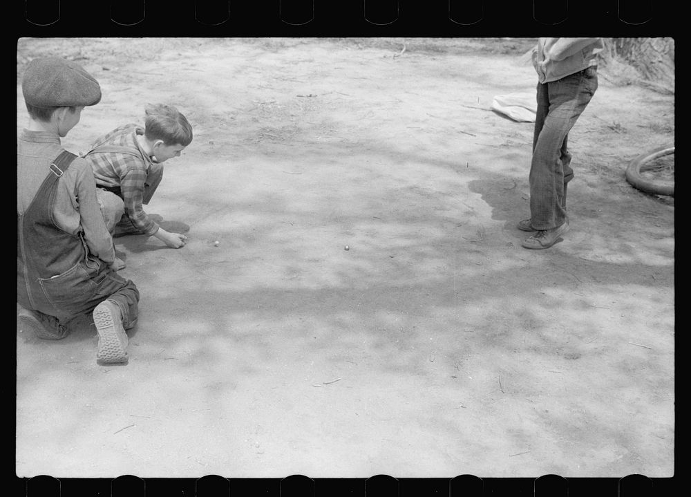 [Untitled photo, possibly related to: Boys playing marbles, Woodbine, Iowa]. Sourced from the Library of Congress.