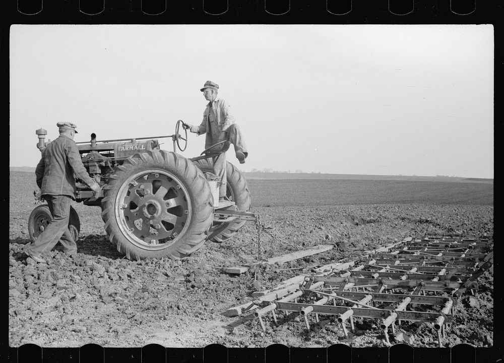 [Untitled photo, possibly related to: Adjusting wire in stake. Corn planting, Jasper County, Iowa]. Sourced from the Library…