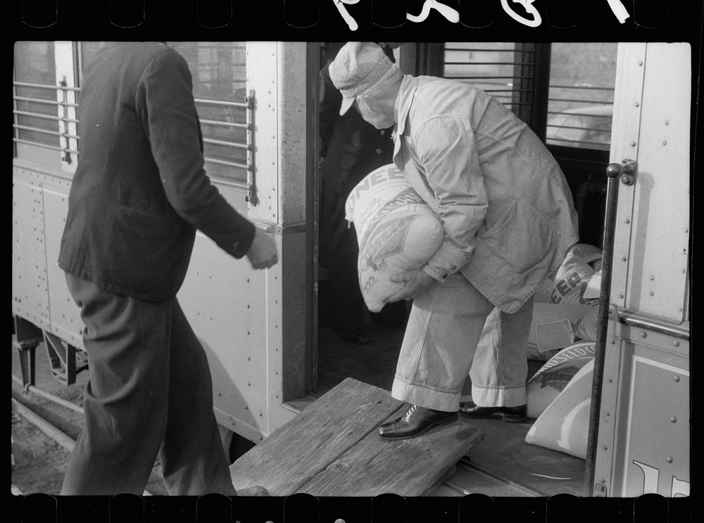 [Untitled photo, possibly related to: Motorman of inter-urban railway receiving lunch from his wife. They are residents of…