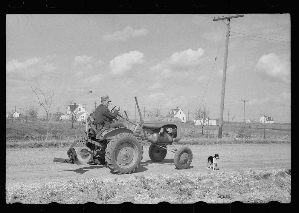 [Untitled photo, possibly related to: Cooperatively-owned tractor at Granger Homesteads, Iowa]. Sourced from the Library of…
