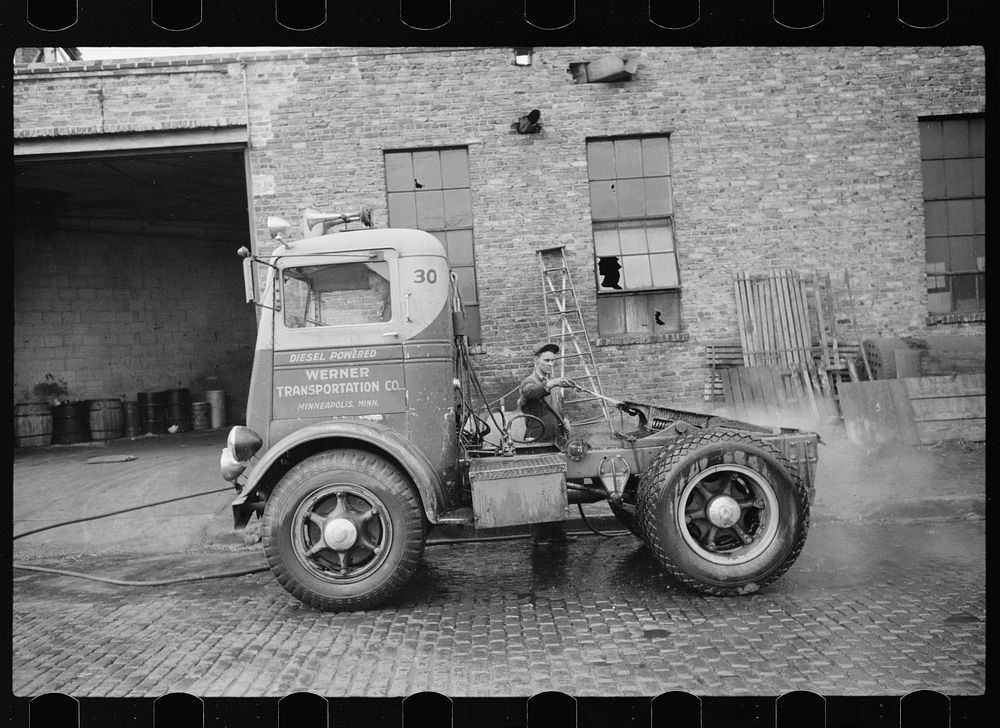 Washing truck chassis before sending to garage for overhauling. Minneapolis, Minnesota. Sourced from the Library of Congress.