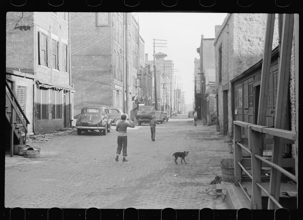 Boys playing in alley, Dubuque, Iowa. Sourced from the Library of Congress.