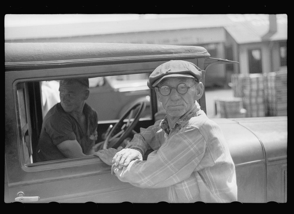[Untitled photo, possibly related to: Farmer at produce market, Benton Harbor, Michigan]. Sourced from the Library of…