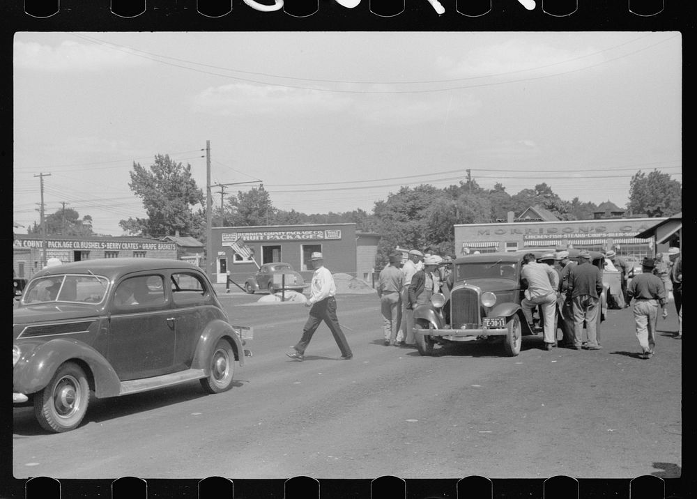 [Untitled photo, possibly related to: Farmers at produce market, Benton Harbor, Michigan]. Sourced from the Library of…