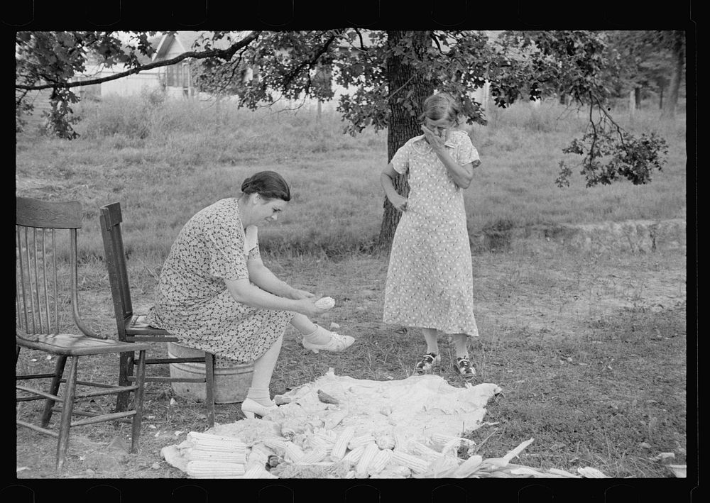 Demonstrating process of canning corn at community canning kitchen near Atkins, Arkansas. Sourced from the Library of…