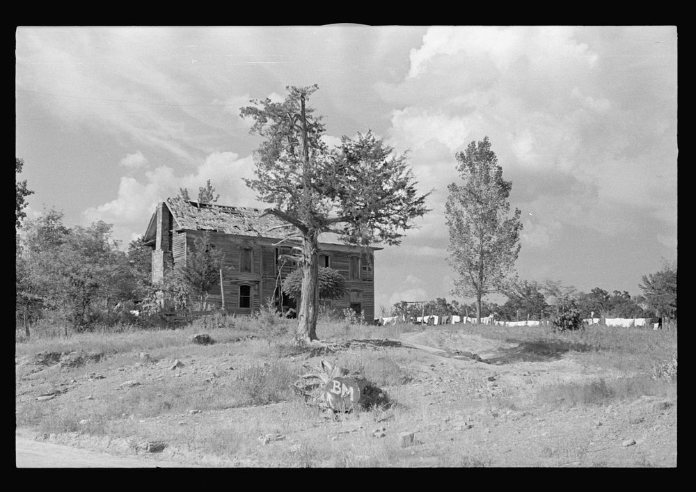 Old stage coach tavern near Huntsville, Arkansas, now inhabited by rehabilitation client. Sourced from the Library of…