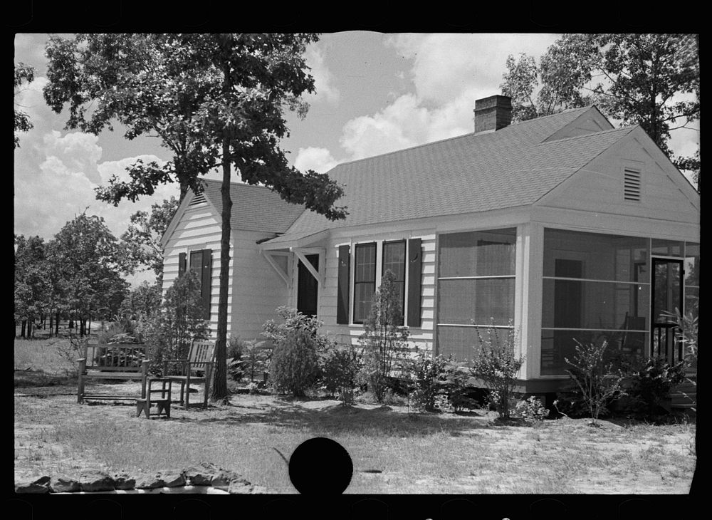 [Untitled photo, possibly related to: House and garage at Magnolia Homesteads, Lauderdale County, Mississippi]. Sourced from…