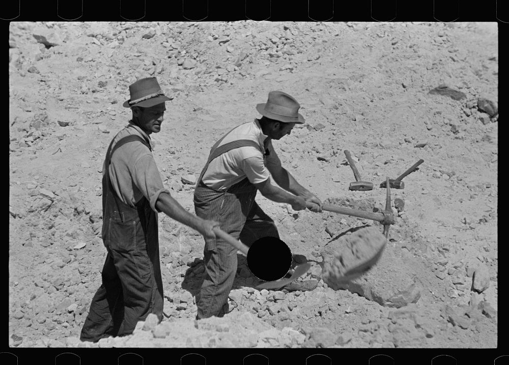 [Untitled photo, possibly related to: Farmers who have been resettled at Skyline Farms, at work in sand pit]. Sourced from…