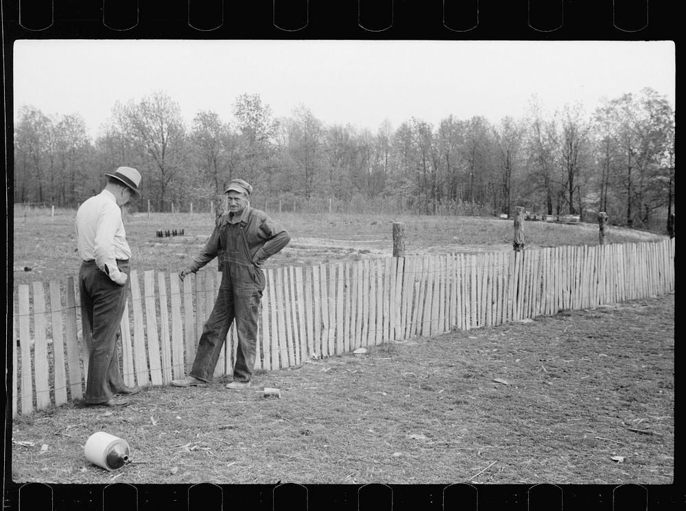 County supervisor visiting FSA (Farm Security Administration) borrower who is building a picket fence around his place…