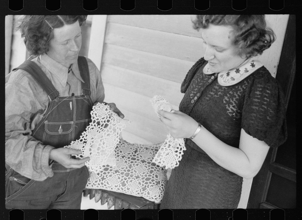 [Untitled photo, possibly related to: Rehabilitation borrower showing lace work she has made to home supervisor, Grant…
