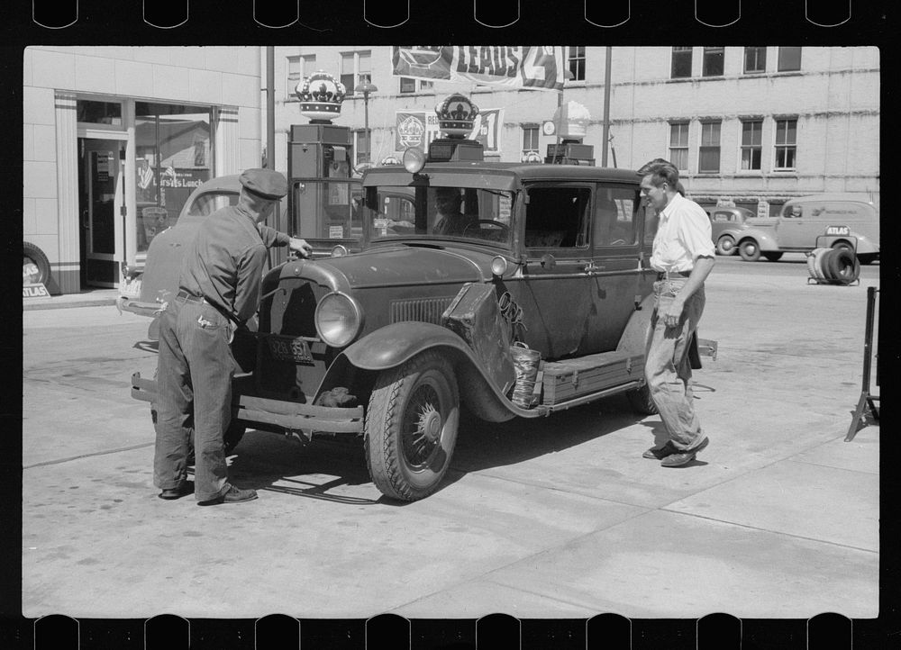 Auto of migrant fruit worker at gas station, Sturgeon Bay, Wisconsin. Sourced from the Library of Congress.