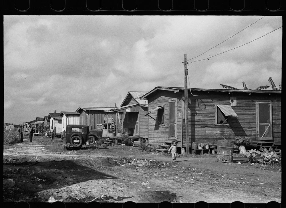 [Untitled photo, possibly related to: A row of houses in the  section, Belle Glade, Florida]. Sourced from the Library of…
