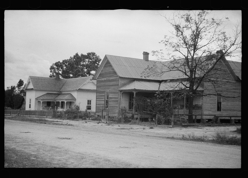 Old house with remodeled house in background, Irwin County, Georgia. Sourced from the Library of Congress.