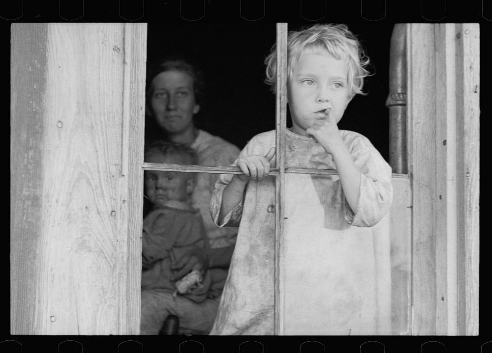 Daughter of sharecropper, Wilmington, North Carolina. Mother and another child in background. Sourced from the Library of…