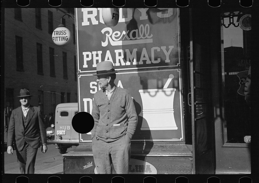 [Untitled photo, possibly related to: Men on main street, Saturday afternoon, Hagerstown, Maryland]. Sourced from the…