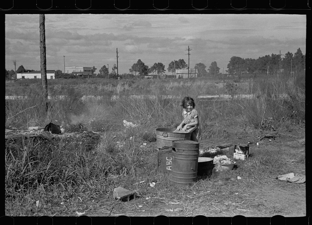 Wash day. The daughter of a migrant fruit worker from Tennessee, now encamped near Winter Haven, Florida. Sourced from the…