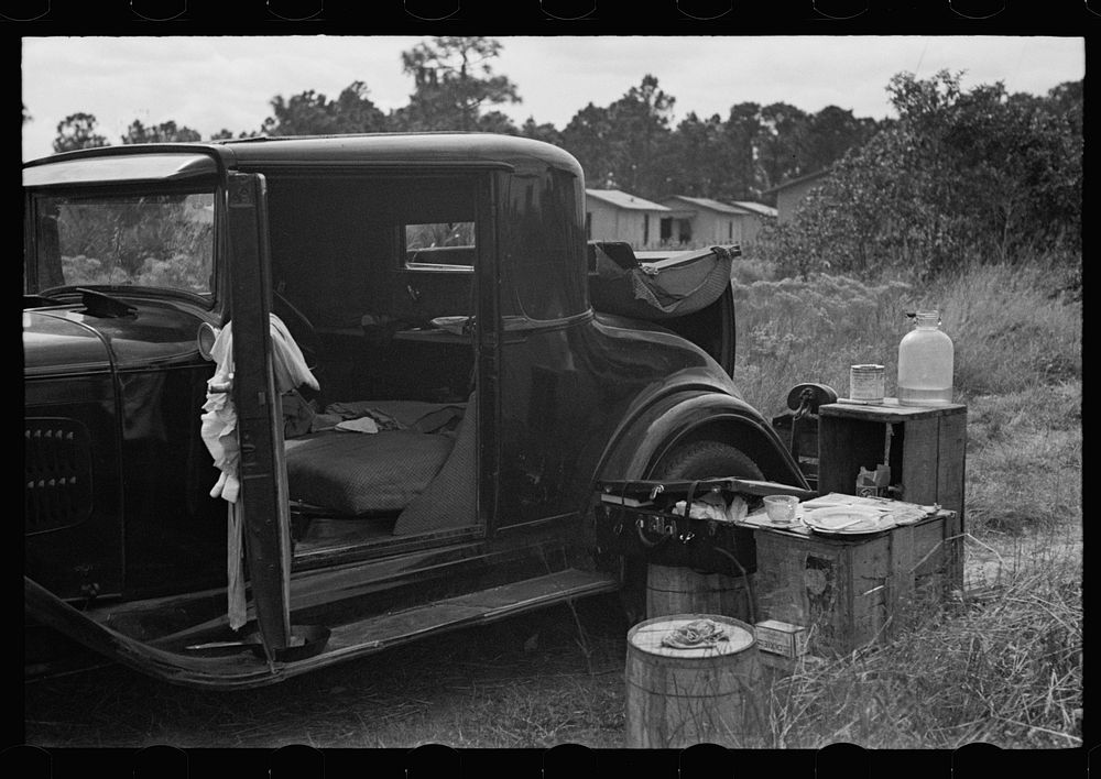 Car used by migrant agricultural workers; the rear has been fixed up as a bed, near Winter Haven, Florida. Sourced from the…
