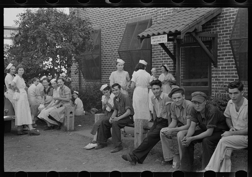 Workers in canning plant during change of shift. Many of these are migratory. Polk County, Florida. Sourced from the Library…