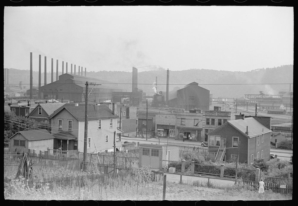 Center of town with steel plant behind business district, Midland, Pennsylvania. Sourced from the Library of Congress.