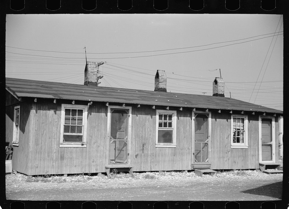 [Untitled photo, possibly related to: Community toilets used by people living in company houses near oyster packing plant…