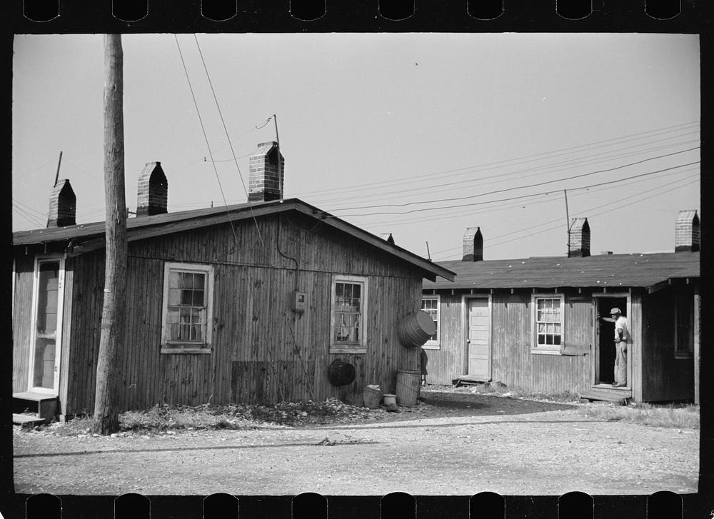 [Untitled photo, possibly related to: Community toilets used by people living in company houses near oyster packing plant…