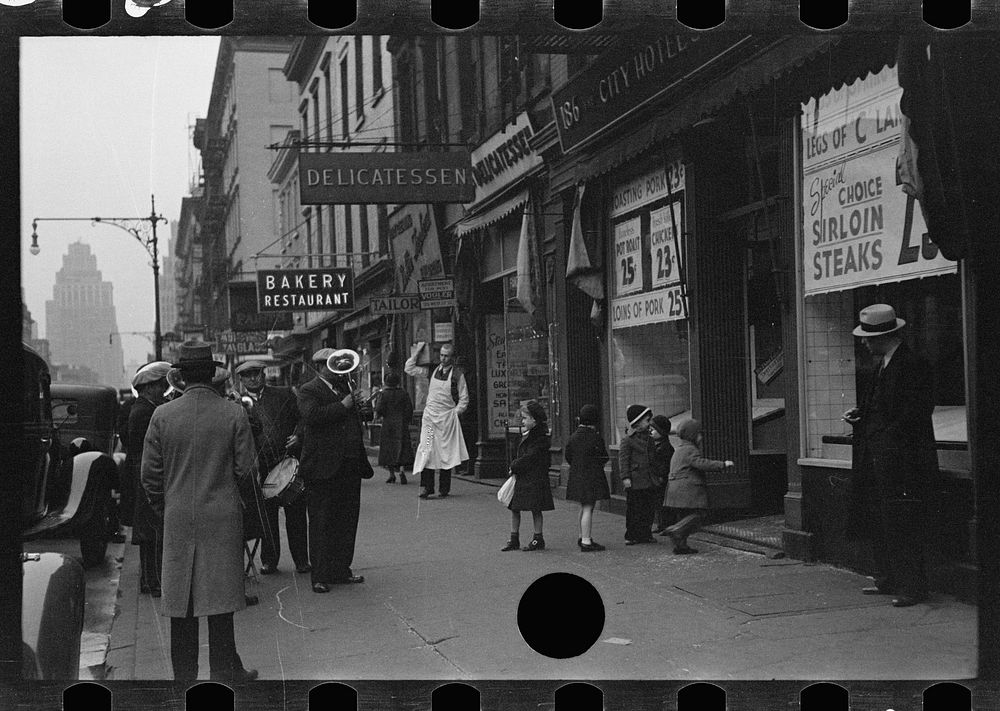 [Street band on sidewalk, Eighth Avenue looking north from between West 19th and 20th Streets, New York, New York]. Sourced…