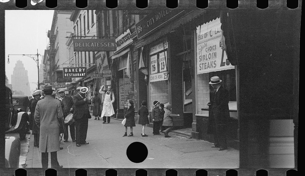 [Street band on sidewalk, Eighth Avenue looking north from between West 19th and 20th Streets, New York, New York]. Sourced…