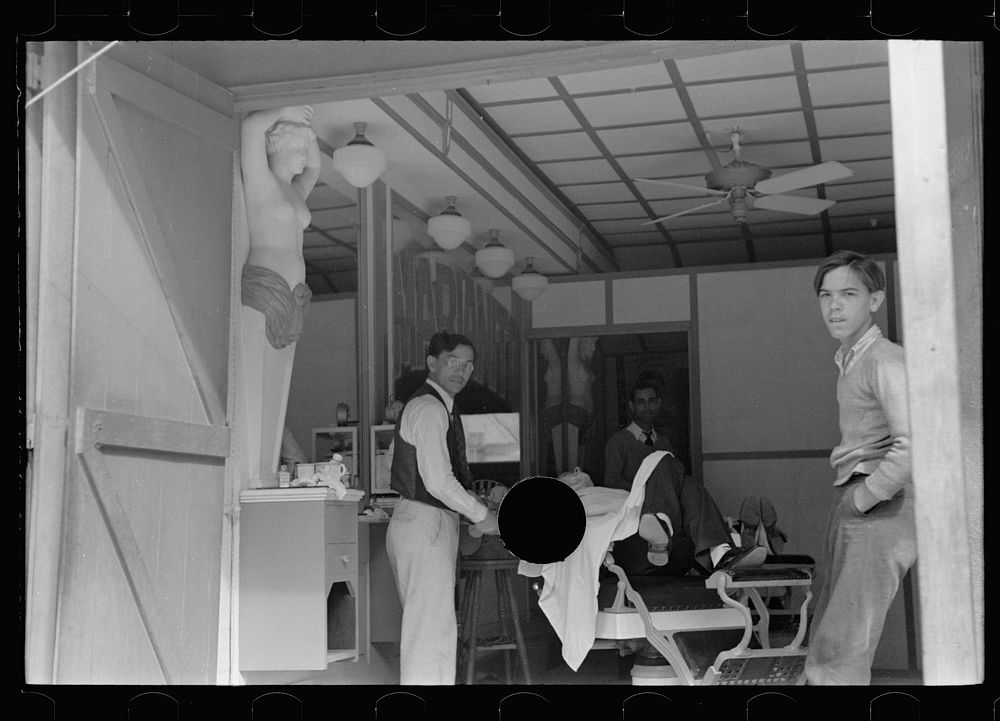 [Untitled photo, possibly related to: Loungers in barbershop, Key West, Florida]. Sourced from the Library of Congress.