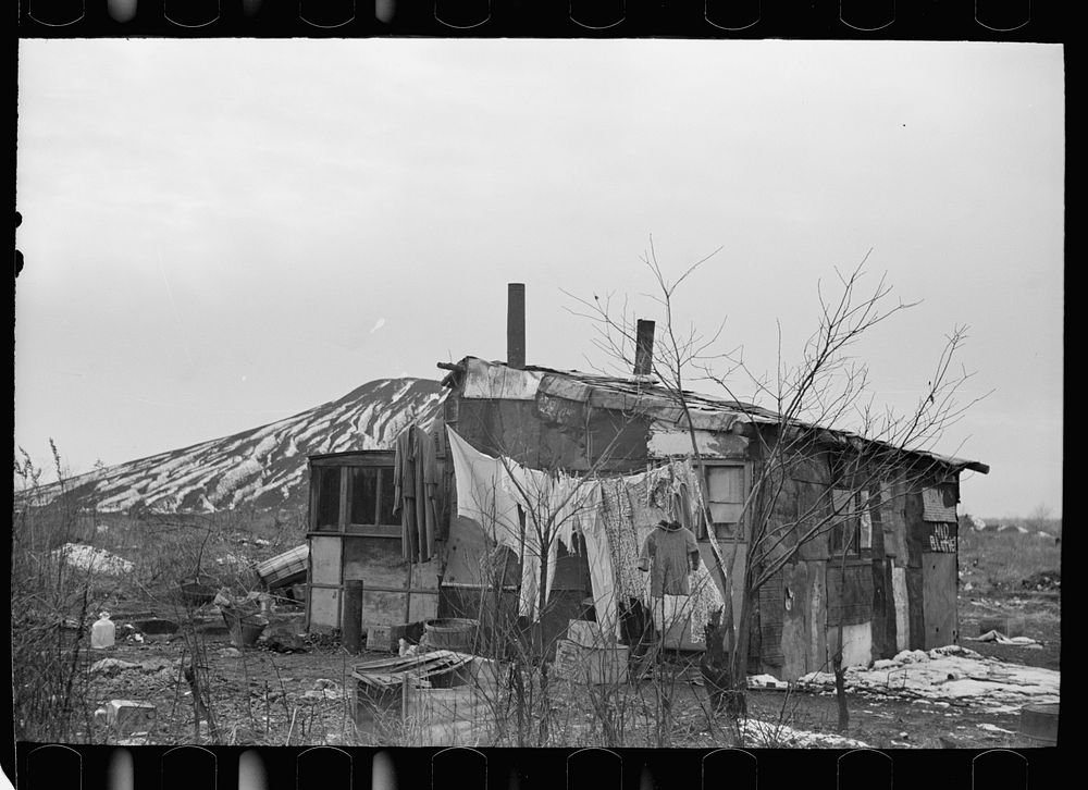 A shanty built of refuse near the Sunnyside slack pile, Herrin, Illinois Many residences in southern Illinois coal towns…