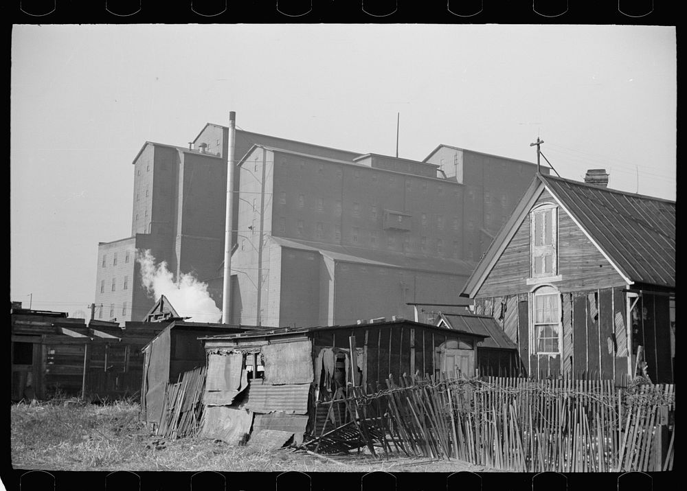 Squatters' shacks with grain elevator in background, Saint Louis, Missouri. Sourced from the Library of Congress.