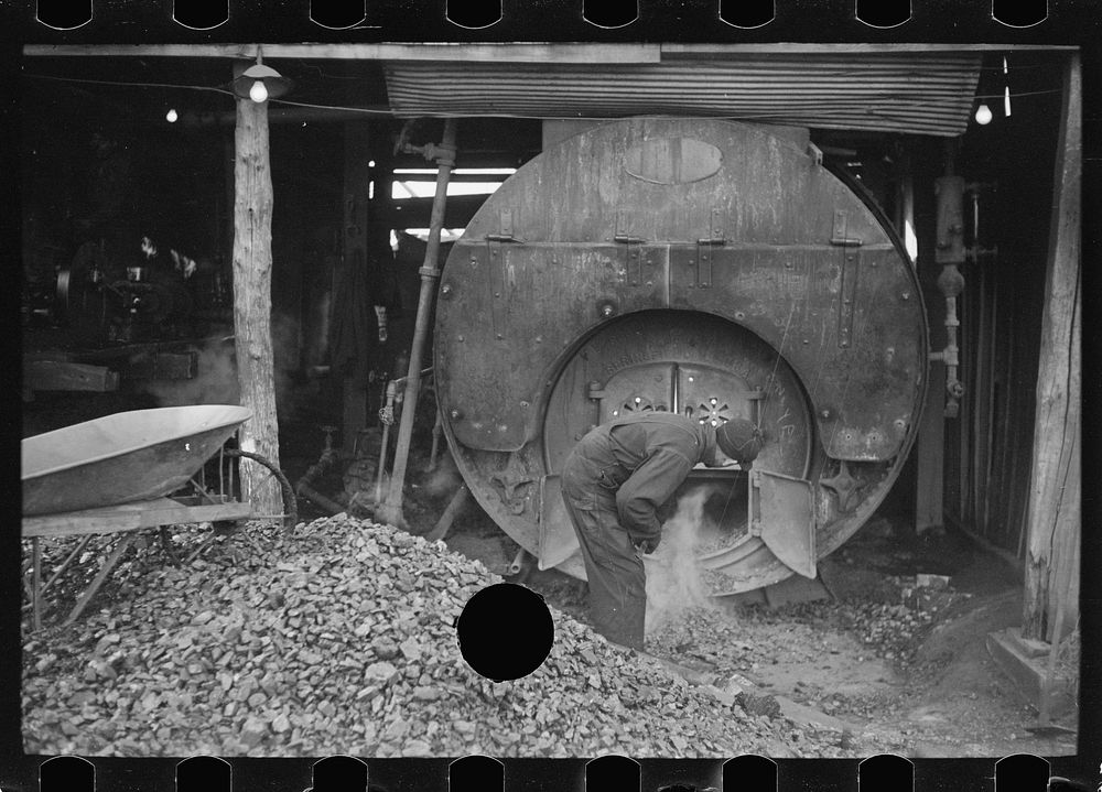 [Untitled photo, possibly related to: Stoking furnace at gopher hole, Williamson County, Illinois]. Sourced from the Library…