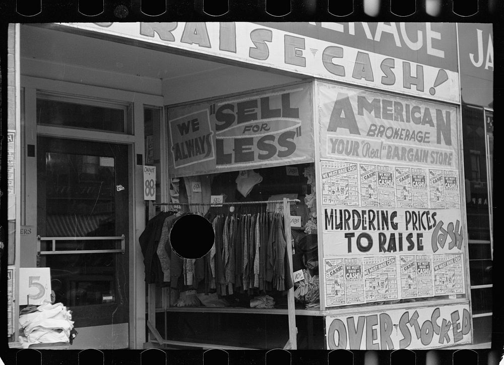 [Untitled photo, possibly related to: Storefront, West Frankfort, Illinois. Window of advertising: "We must help raise…